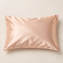 Smoozely silk pillowcase studio view in apricot glow