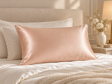 Smoozely silk pillowcase in a bedroom setting, colour apricot glow