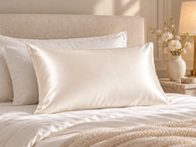 Smoozely silk pillowcase in a bedroom setting, colour ivory cloud