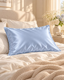 Smoozely silk pillowcase in a bedroom setting, colour morning sky